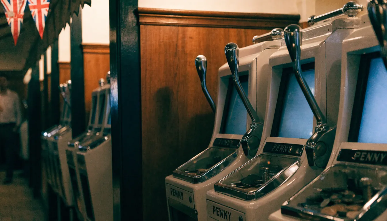 Vintage penny slot machines in a traditional British arcade